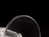 a close up of a wine glass on a table