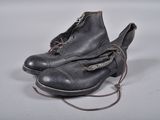 a pair of shoes that are tied up on a table