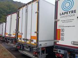 a lot of trucks that are lined up on the side of the road