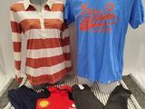 two men ' s shirts and pants are on display in a display case