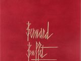 a red book with a gold writing on the cover