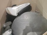 a ball in a box with other items inside of it