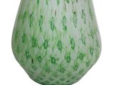 green and white glass vase on a white surface with a white background