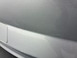 a close up of a car ' s door handle with a crack in it