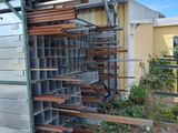 a large metal container with lots of wood in it