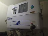 a water heater that is on top of a wall