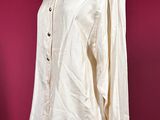 an image of a white shirt on a mannequin stand