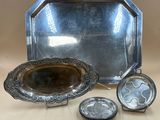 a silver tray with a mirror and a silver tray with a silver tray