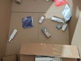 a cardboard box that has a lot of items inside of it