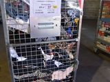 a metal cart with a bunch of items in it