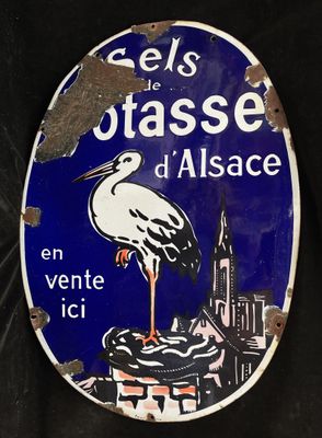a blue and white sign with a stork on it