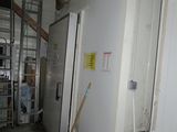 an image of a room with a refrigerator in it