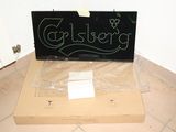 a box with a sign on it sitting on the floor