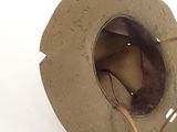 a brown hat with a leather band and a brown hat with a leather band and a brown hat with a leather band and a brown hat with a brown
