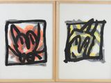 two paintings on the wall one is black and the other is orange