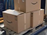 three boxes on a pallet that are sitting on top of a pallet