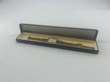 a close up of a watch in a box on a table
