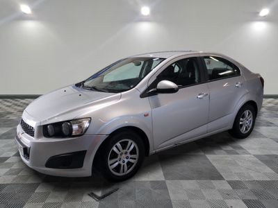 a picture of a silver car parked in a showroom