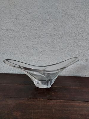 glass bowl on a wooden table with a white wall in the background