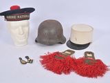a helmet, a hat, and other items that are on a table