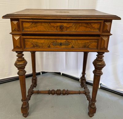 an old wooden table with a drawer on top of it