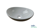 a picture of a white sink with a hole in the center