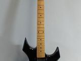 a black electric guitar that is sitting on a white surface