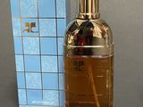 an image of a bottle of perfume next to a box