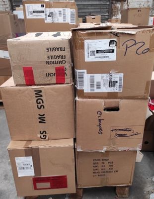 several boxes stacked on top of each other in a warehouse