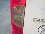 a close up of the tail light of a white car