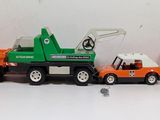 a toy truck with a crane on the back of it