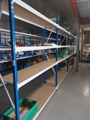 many shelves with boxes on them in a warehouse