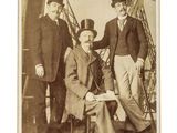 three men in top hats and tails are posing for a picture