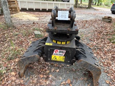 a machine that is sitting on the ground in the woods