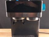 a coffee machine that is sitting on a wooden table