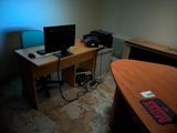 a desk with two computers and a printer on it