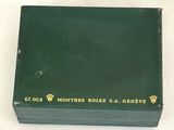 the box is green with gold lettering and a crown on it