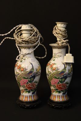 two vases that have been decorated with flowers and birds