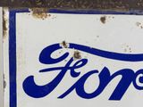 a blue and white sign with the word ford on it
