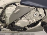 a close up view of a motorcycle engine and its cover