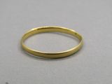a close up of a gold ring on a table