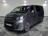 a picture of a grey van parked in a garage