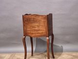 an old wooden chair sitting on top of a hard wood floor