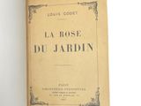 an open book with a picture of a rose on it