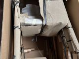 a cardboard box with a chair inside of it
