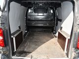 the back of a van with the door open and the back of the van with the door open