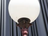 an image of a street light on a pole in front of a building