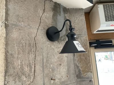 a light that is on the wall next to a window