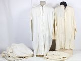 two white shirts on a white table and a white shirt on a white table