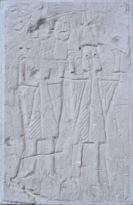 an image of a stone relief of a man and a woman